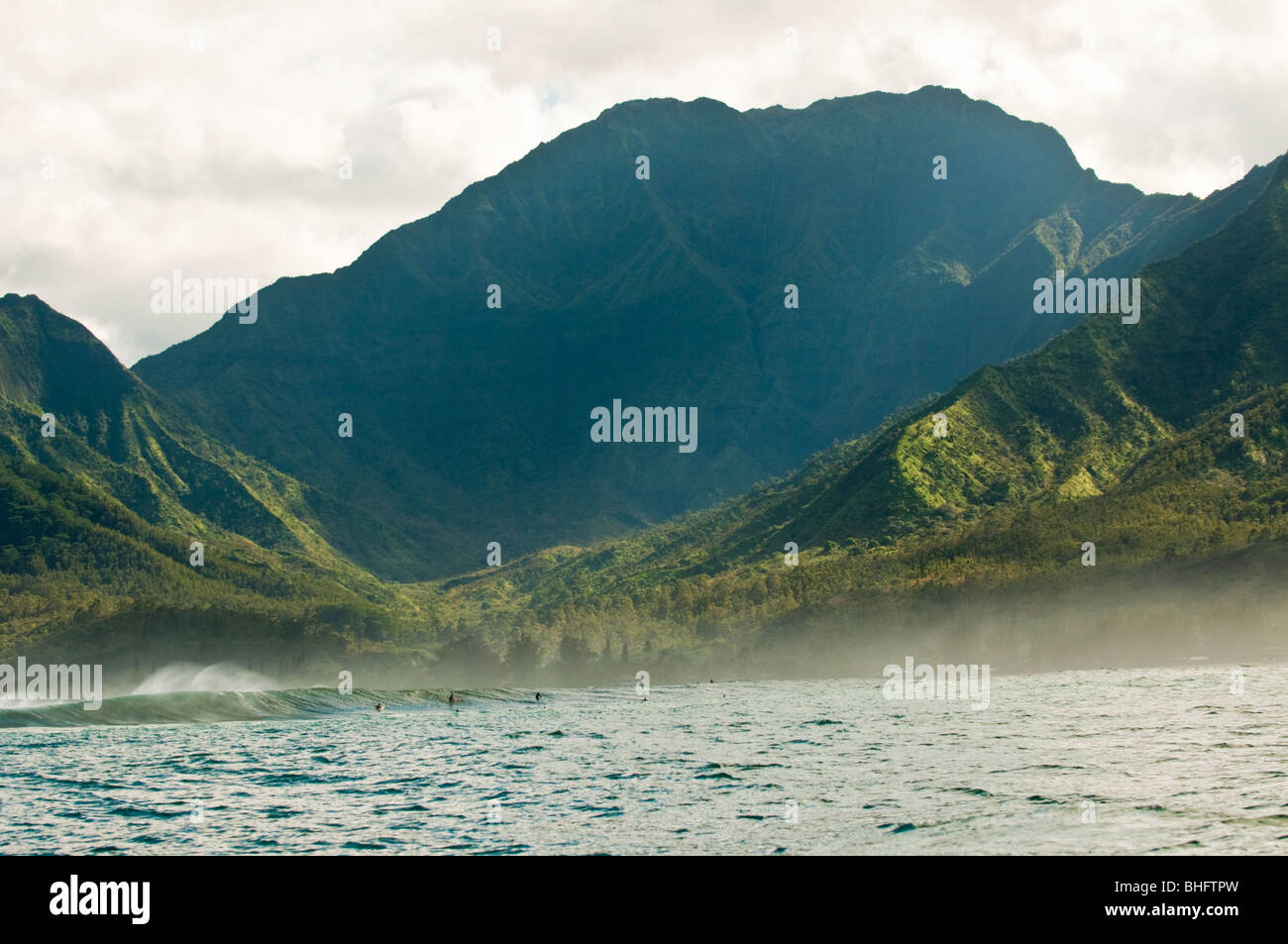 Surfers at Hanalei Bay surf break, seen from offshore, Kauai, Hawaii Stock Photo Alamy