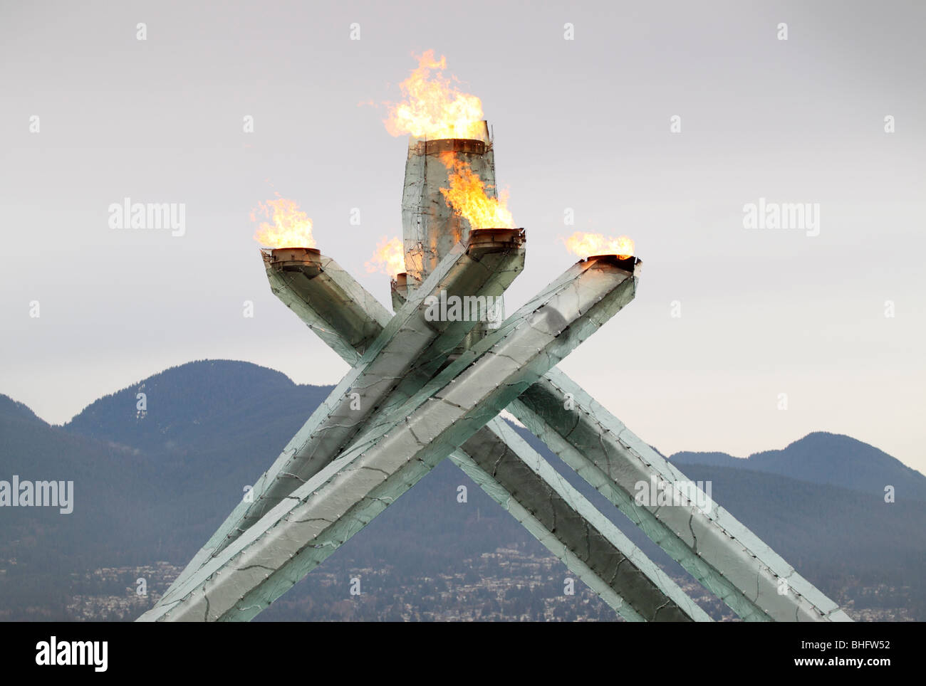 The official flame cauldron for the 2010 Olympic winter games with the North Shore mountains held in Vancouver British Columbia Stock Photo