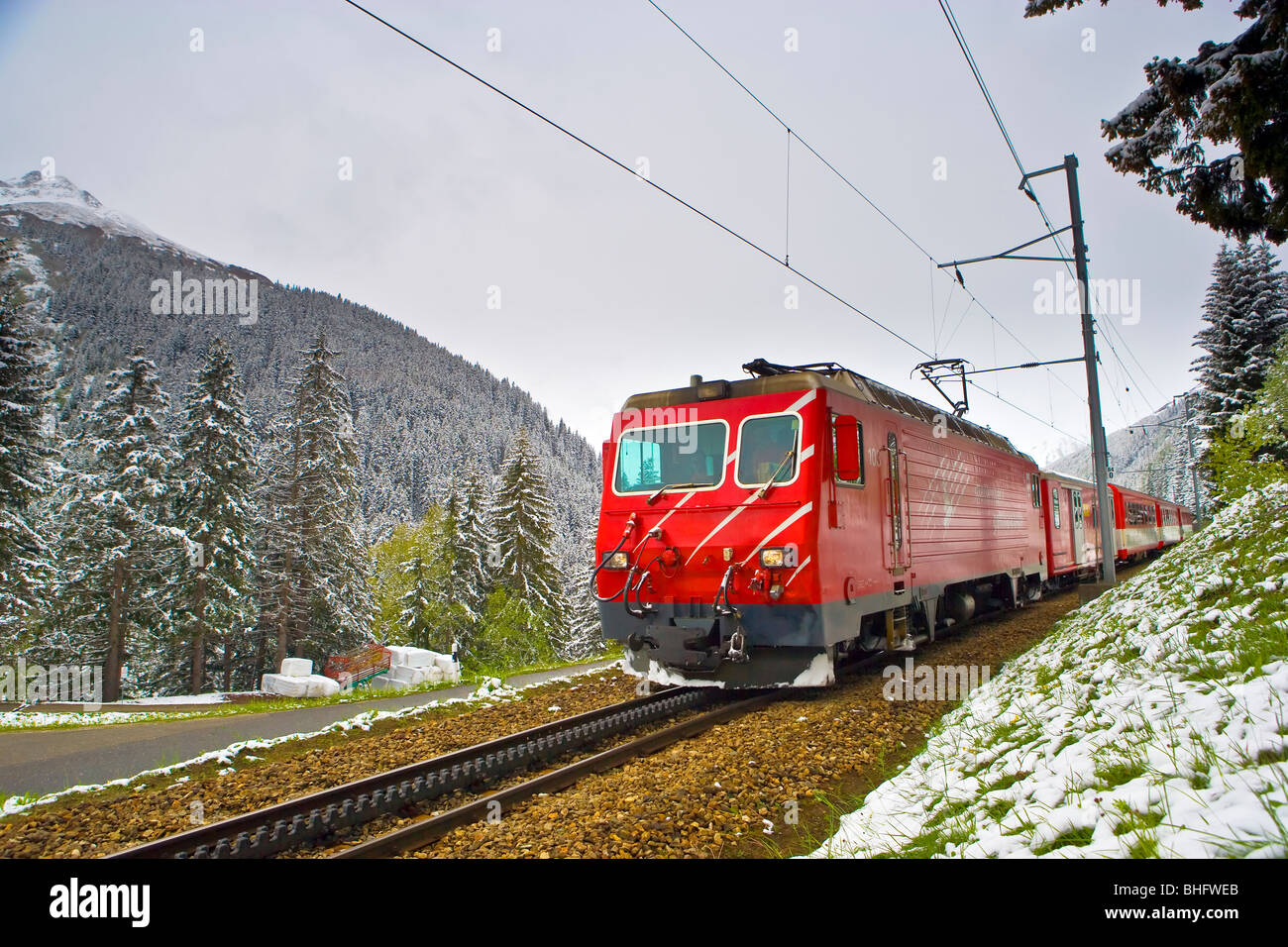 The Matterhorn Gotthard Bahn Train between Andermatt and Sedrun in the snow Switzerland Europe Stock Photo