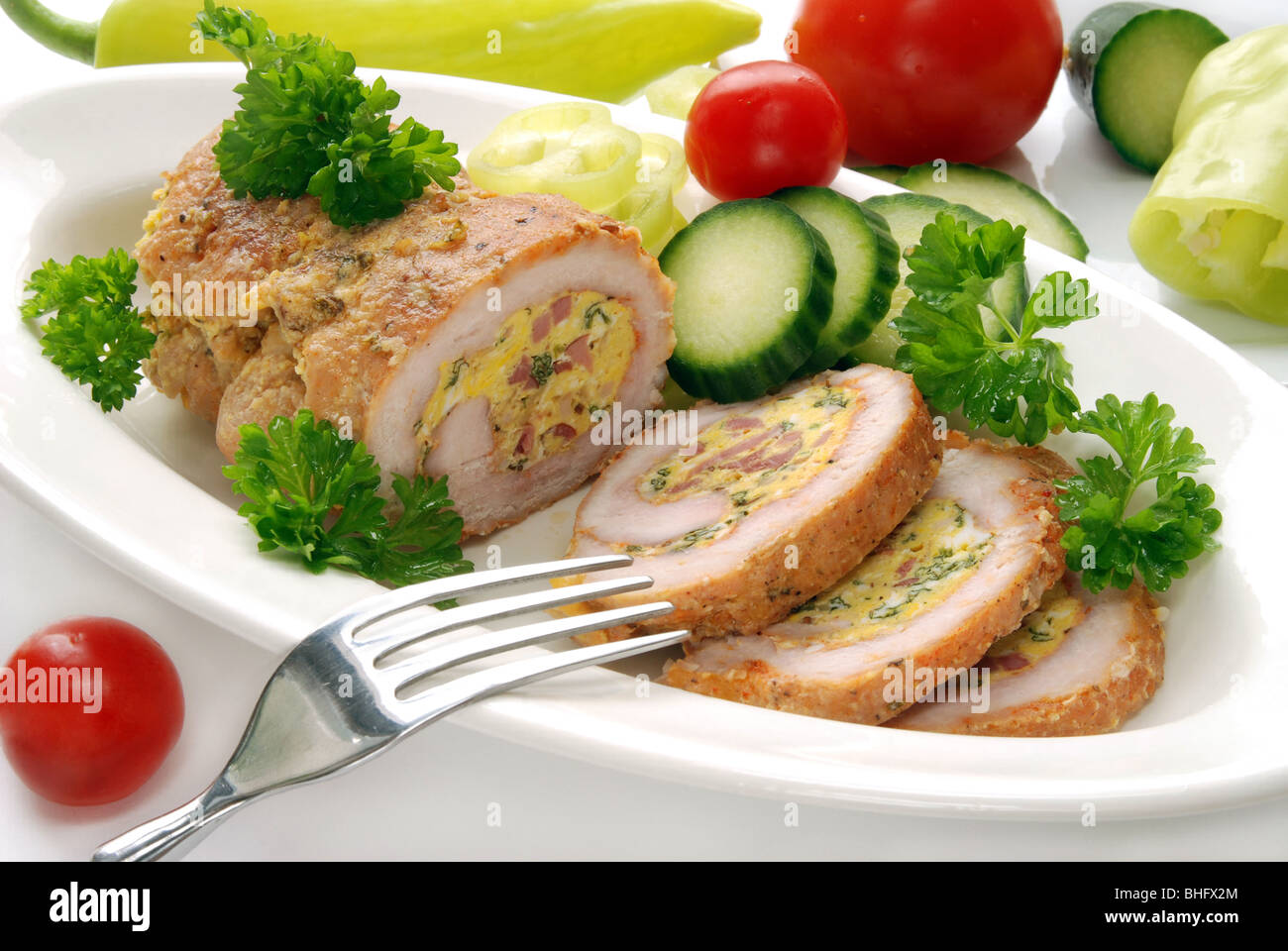 Stuffed turkey meat with vegetable garnish Stock Photo