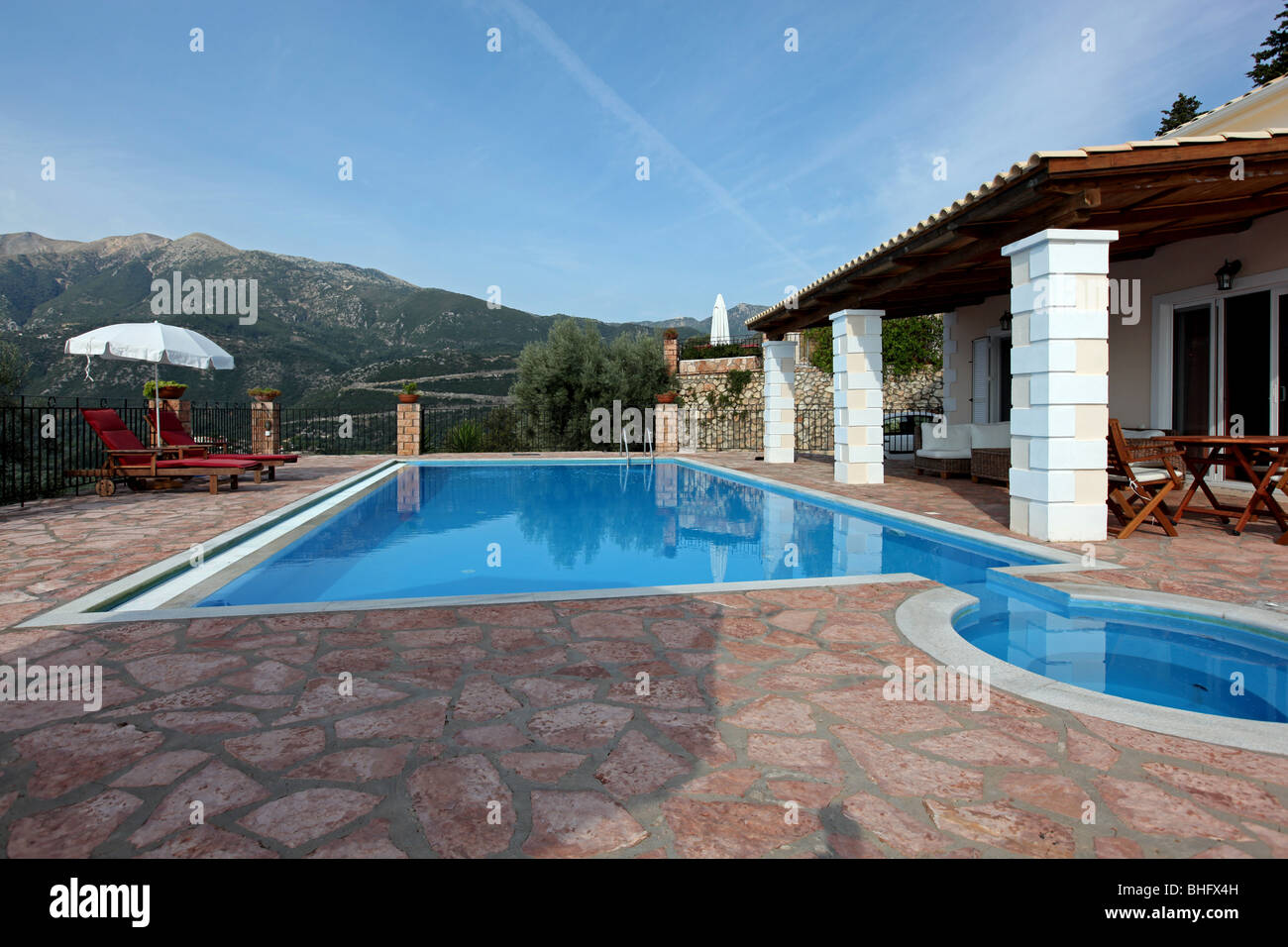Luxury holiday vacation villa with a large private swimming pool. Image taken in the Greek Islands. Stock Photo