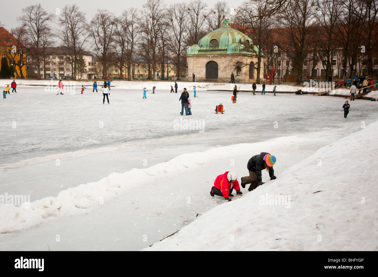 Fun on frozen lake in Nymphenburg, Munich, Germany. Stock Photo