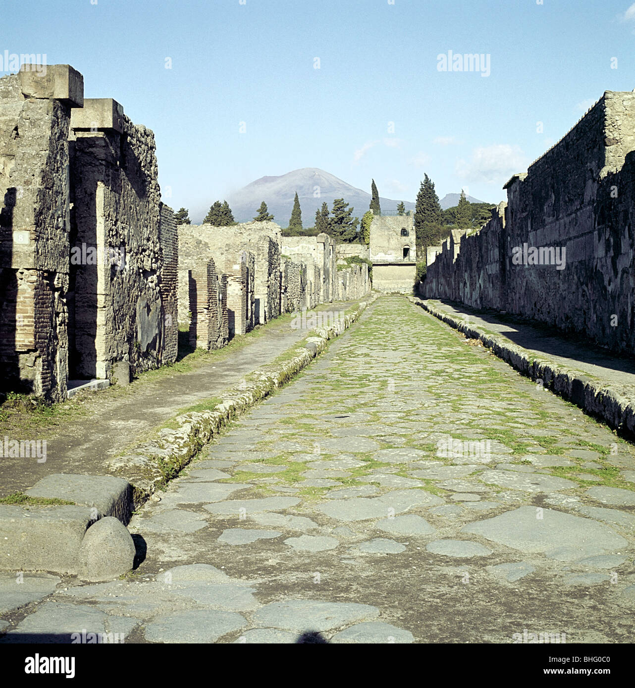 A Pompeii street with Vesuvius in the distance, Italy. Artist Unknown
