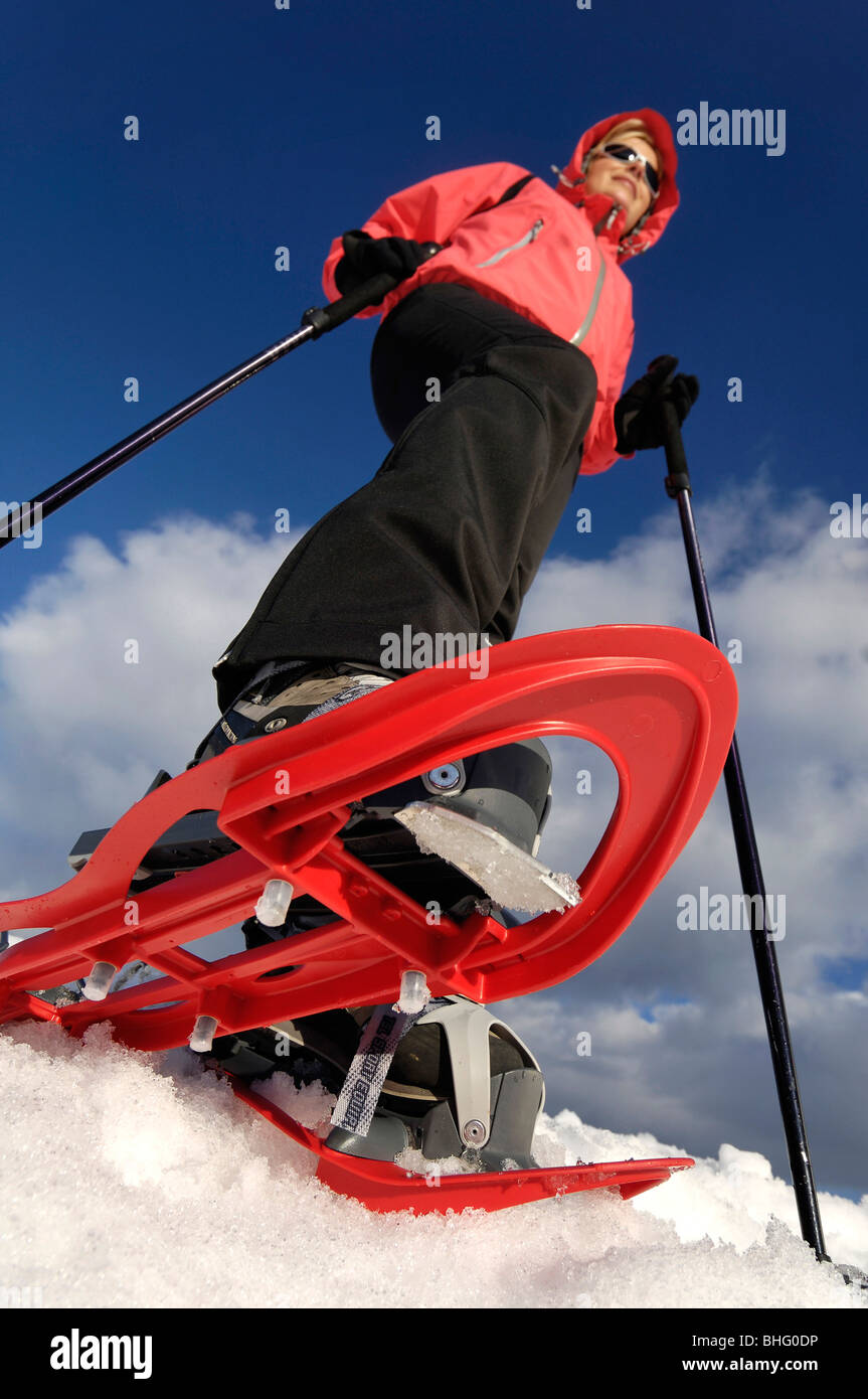 Woman snowshoeing low angle view hires stock photography and images
