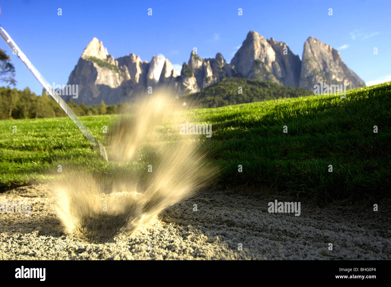Golf club hitting the ball out of the bunker, Golf court Kastelruth Alpe di  Siusi, Sciliar, South Tyrol, Italy, Europe Stock Photo - Alamy