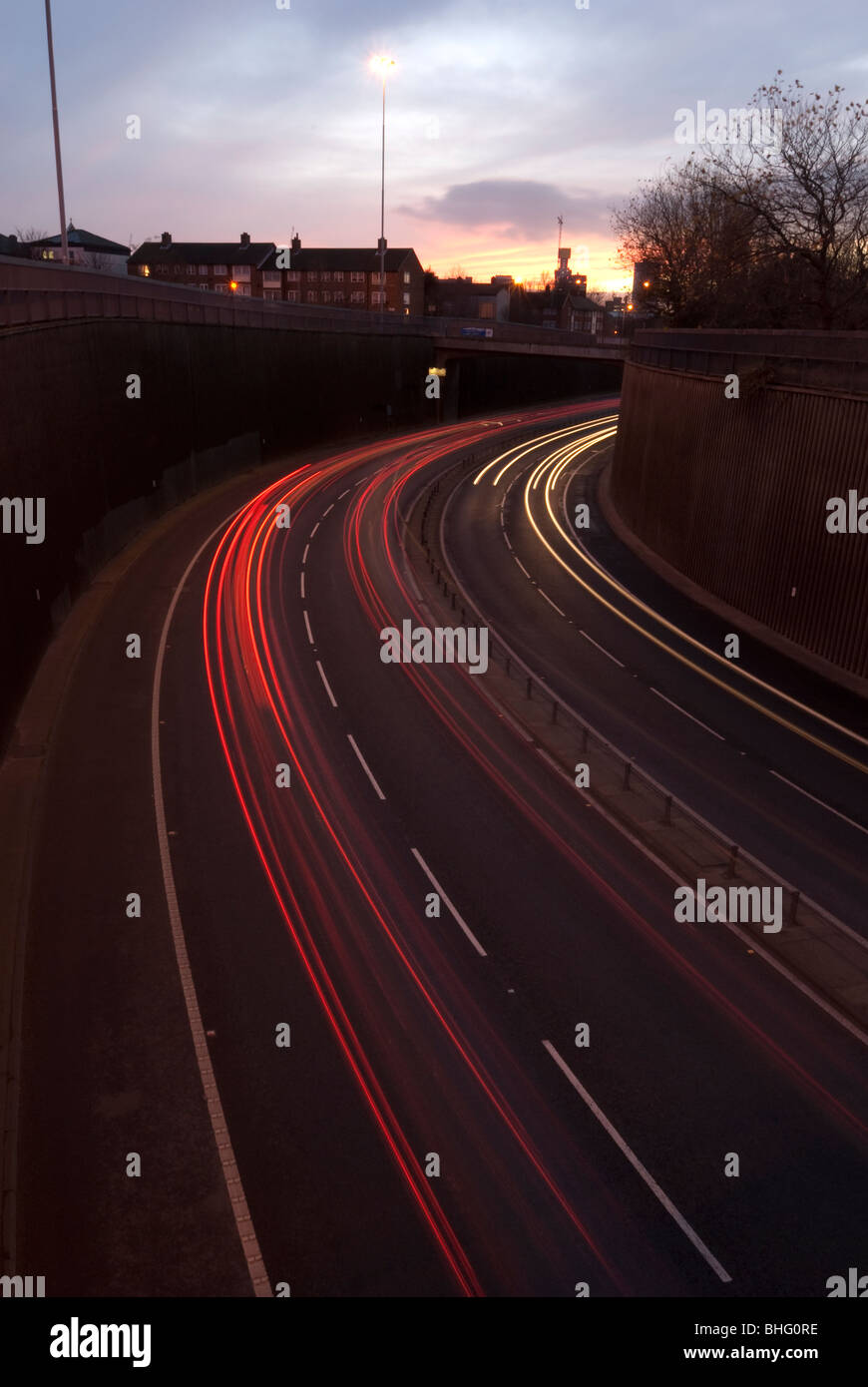 Liverpool to Wallasey Kingsway Tunnel UK approach road at night with car headlight trails Stock Photo