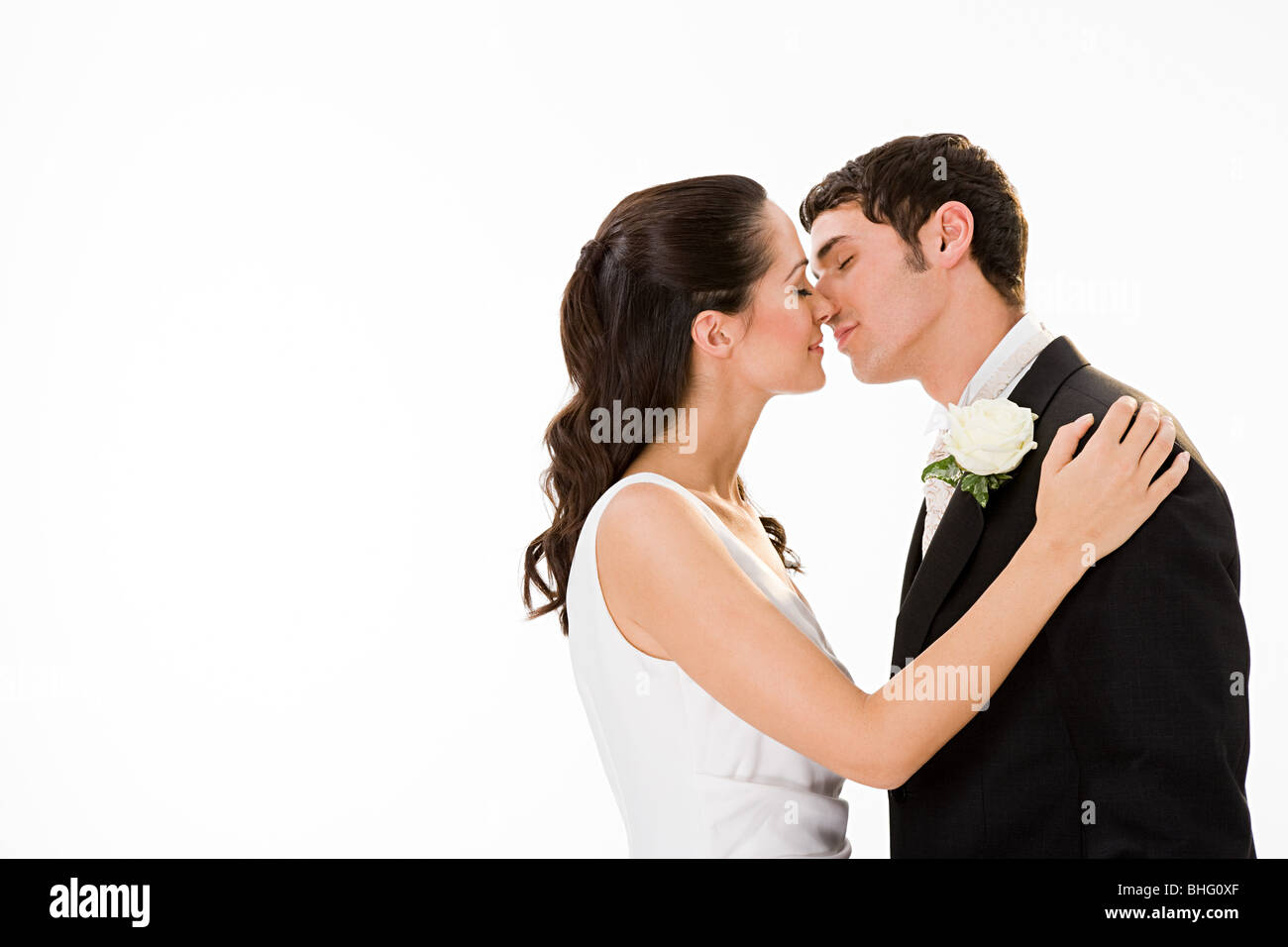 Newlywed couple kissing Stock Photo - Alamy