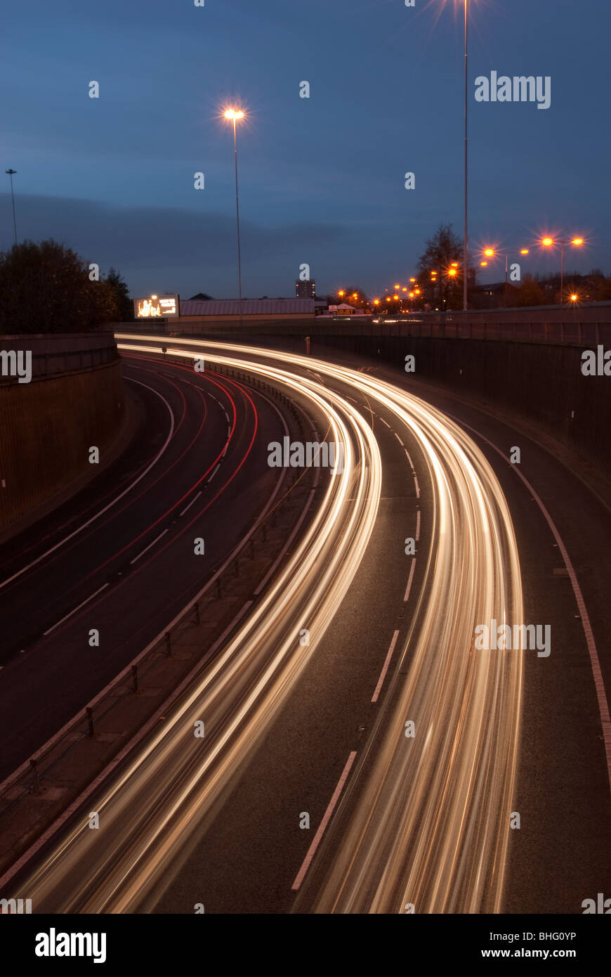 Liverpool to Wallasey Kingsway Tunnel UK approach road at night with car headlight trails Stock Photo