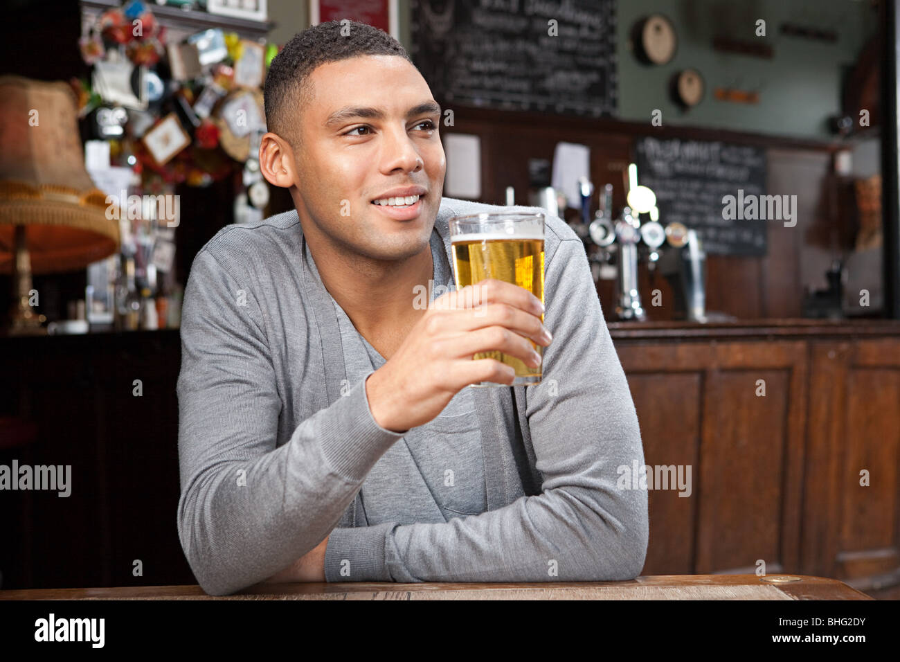 Young man in bar Stock Photo