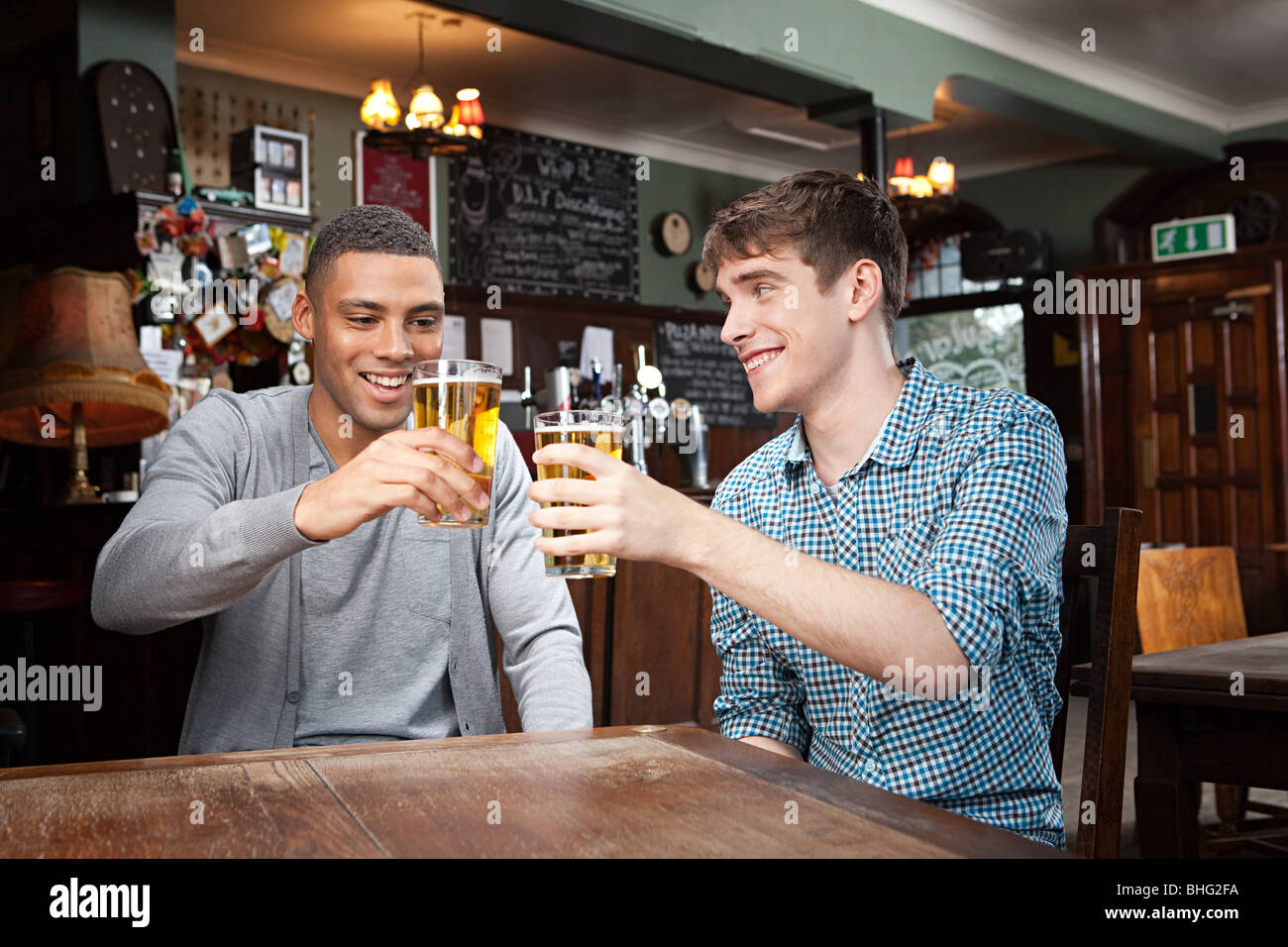 Young men in bar Stock Photo Alamy