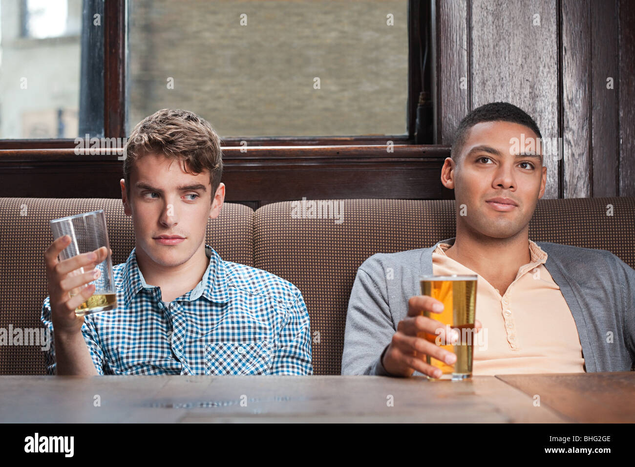 Two young men. Man in Bar.