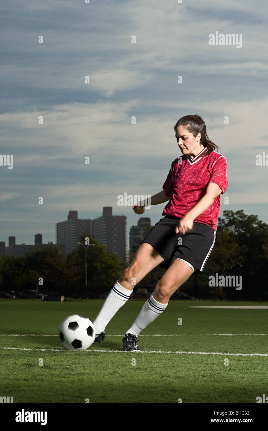 Woman playing football Stock Photo Alamy