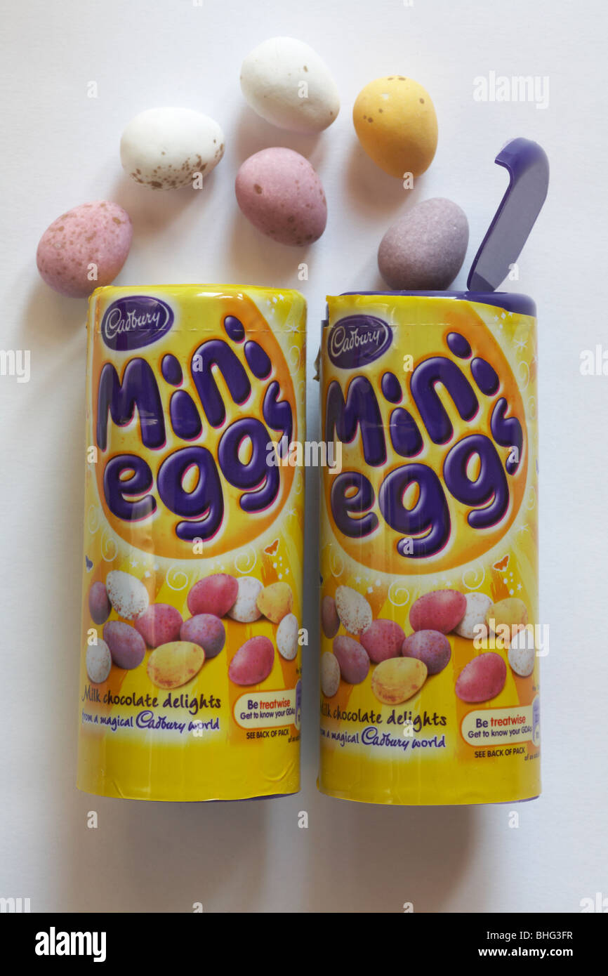 two tubes of Cadbury Mini Eggs, one open with eggs spread around - ready for Easter Stock Photo