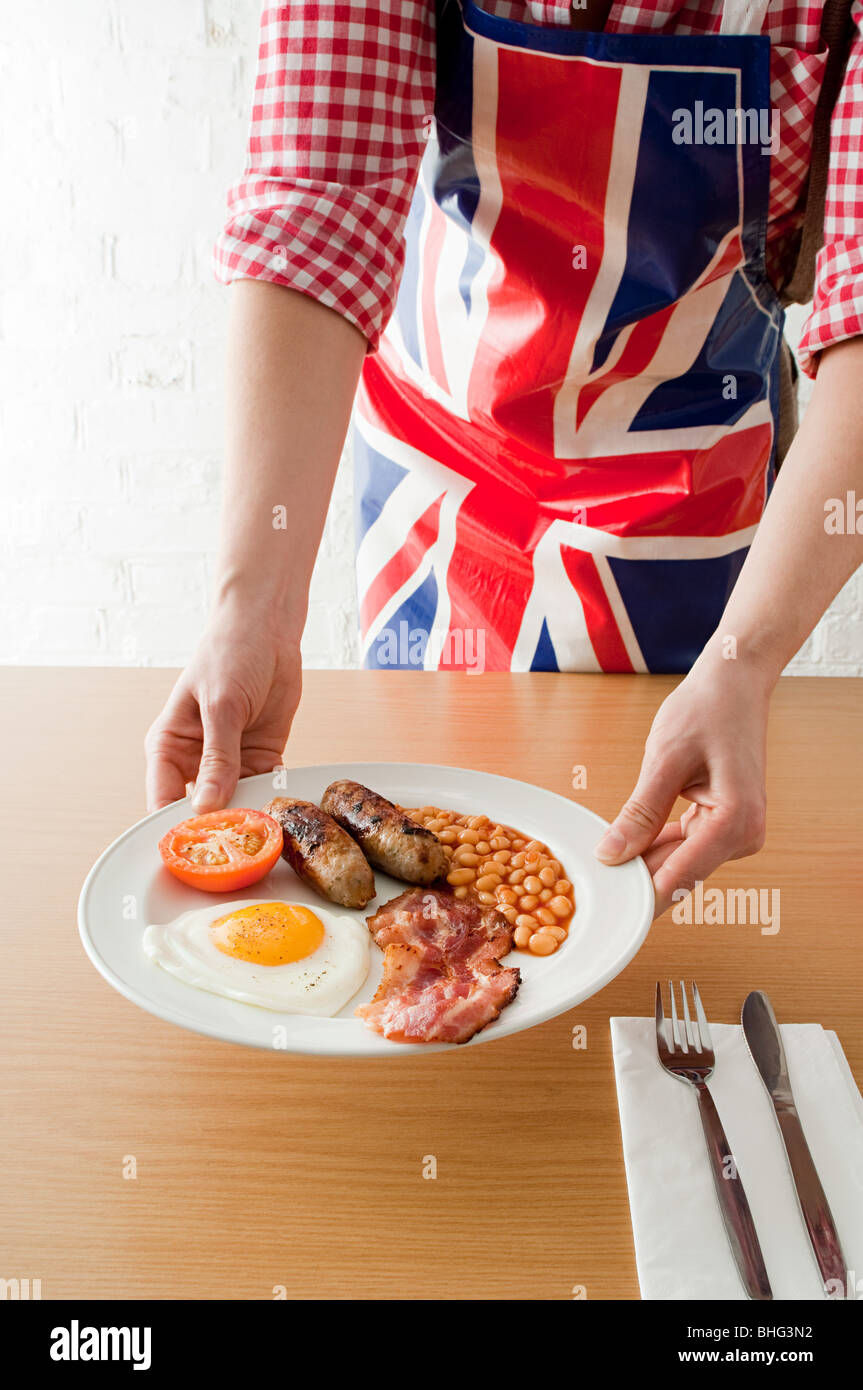 Person serving english breakfast Stock Photo Alamy