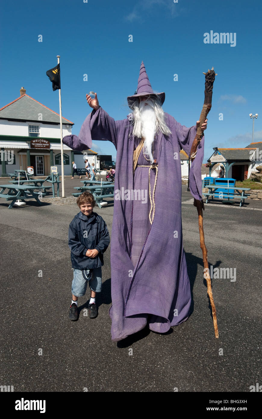Young boy and Merlin Wizzard at Lands End Cornwall UK Stock Photo