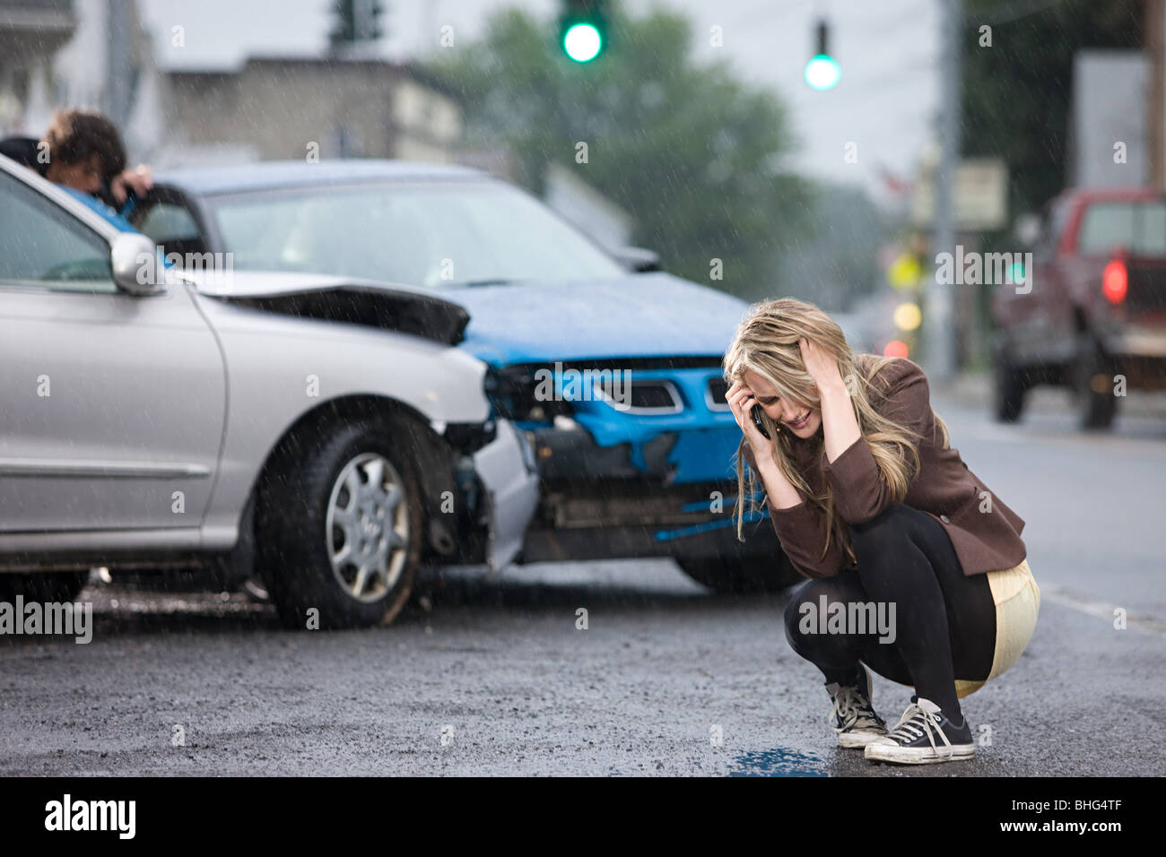 Young woman involved in road accident Stock Photo