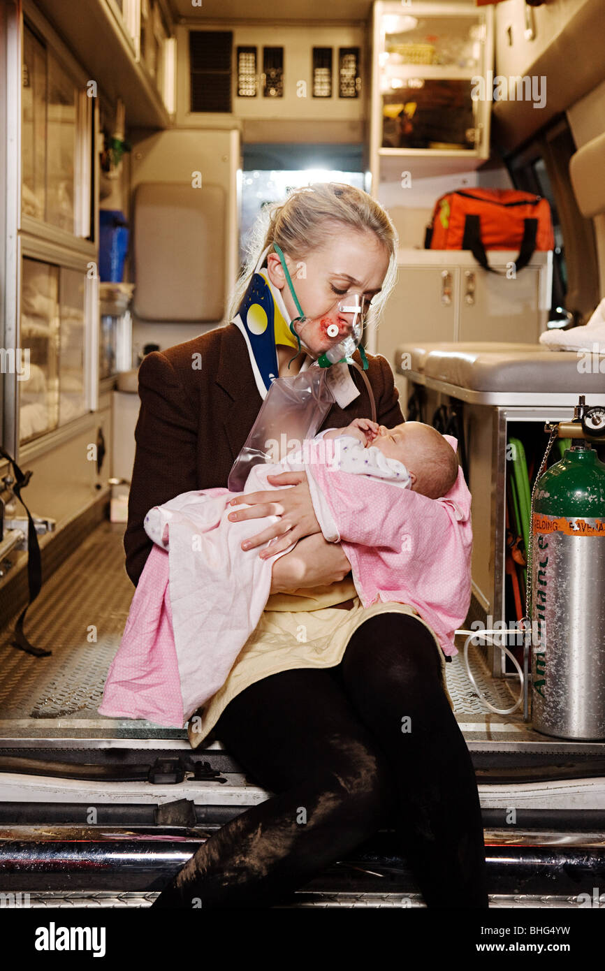 Young woman and baby in ambulance Stock Photo
