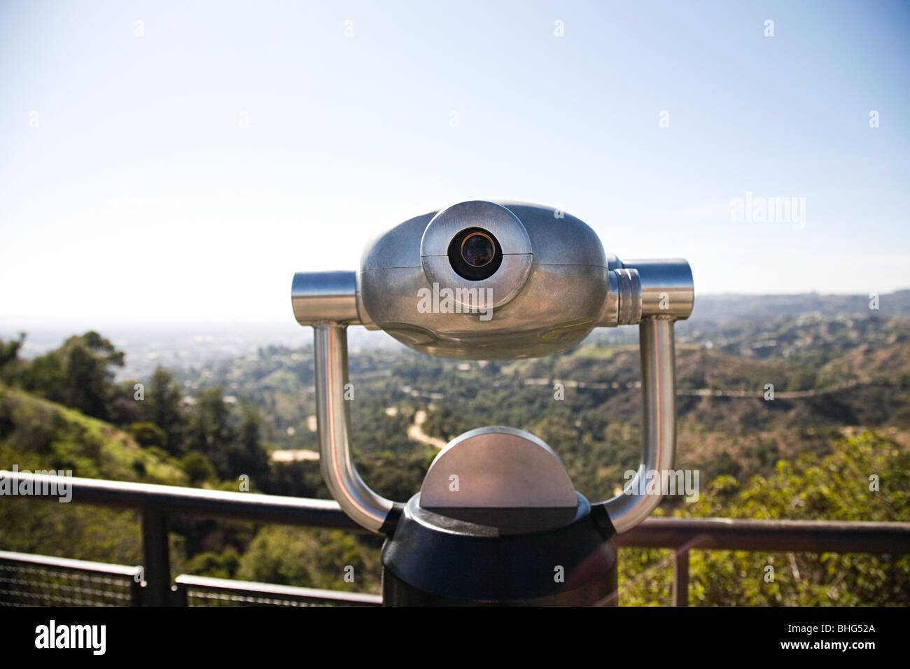 Telescope in griffith park with view of downtown los angeles Stock