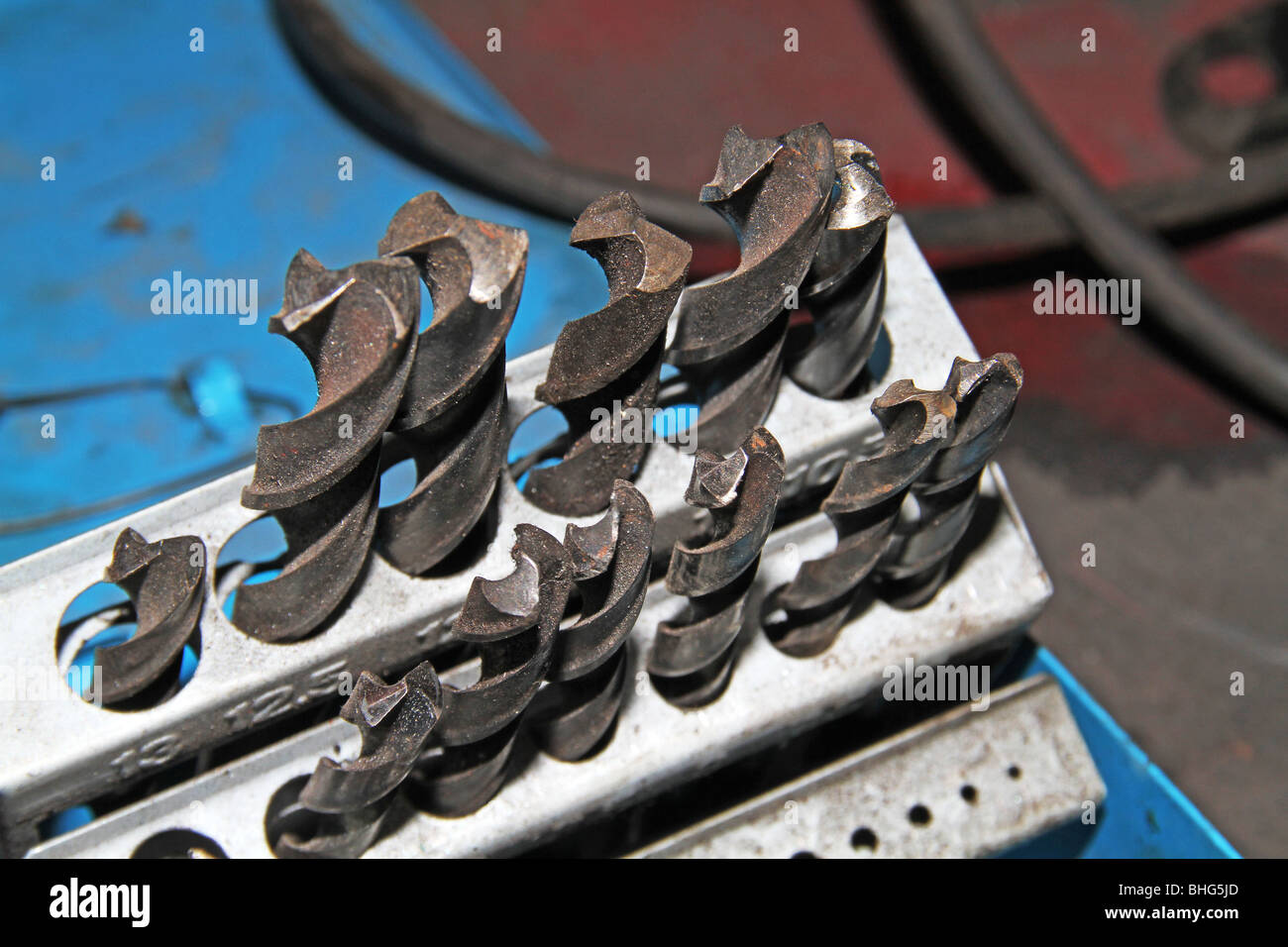 Close image of used twist drills in a ready rack in a Stock