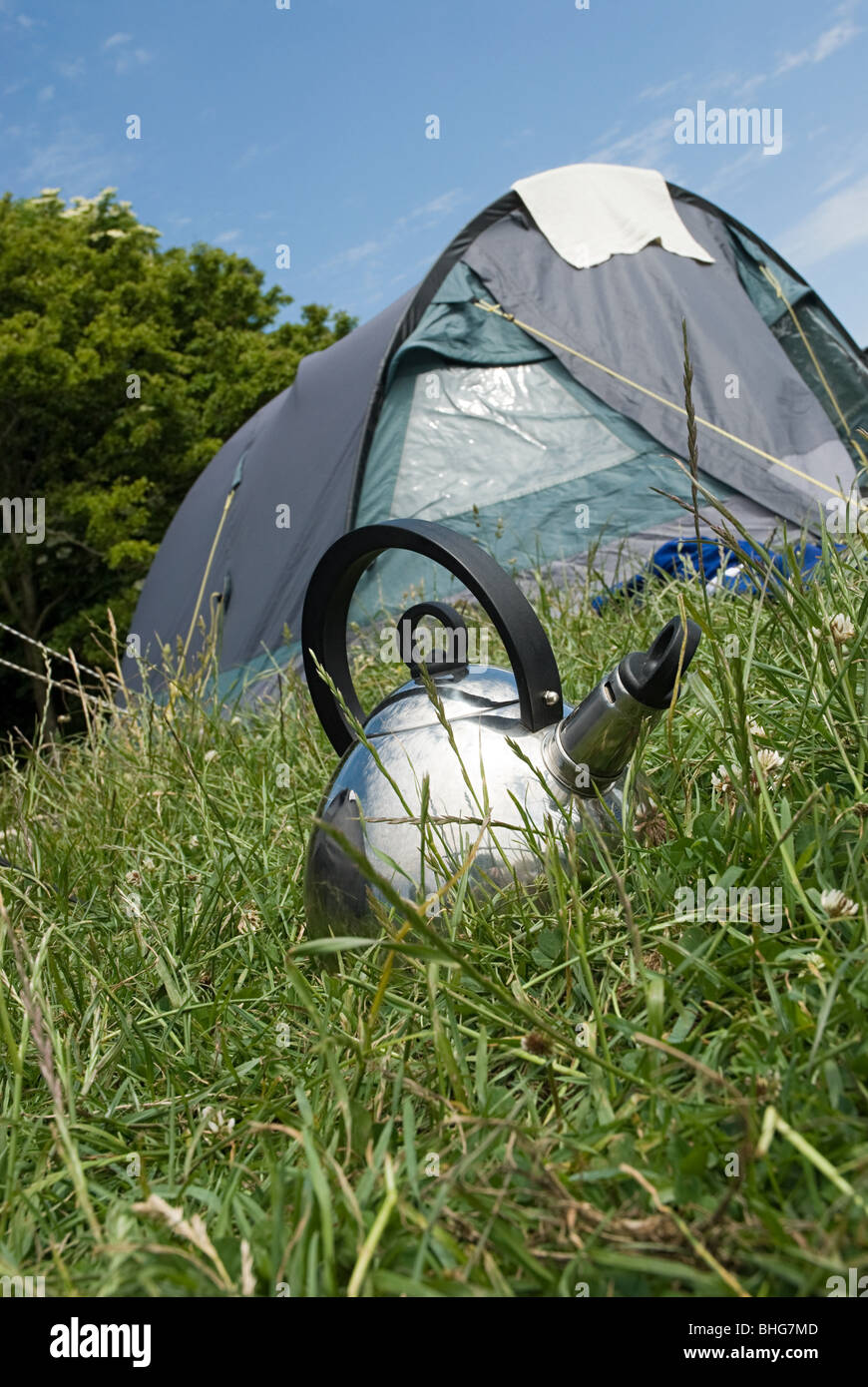Camping kettle and tent Stock Photo Alamy