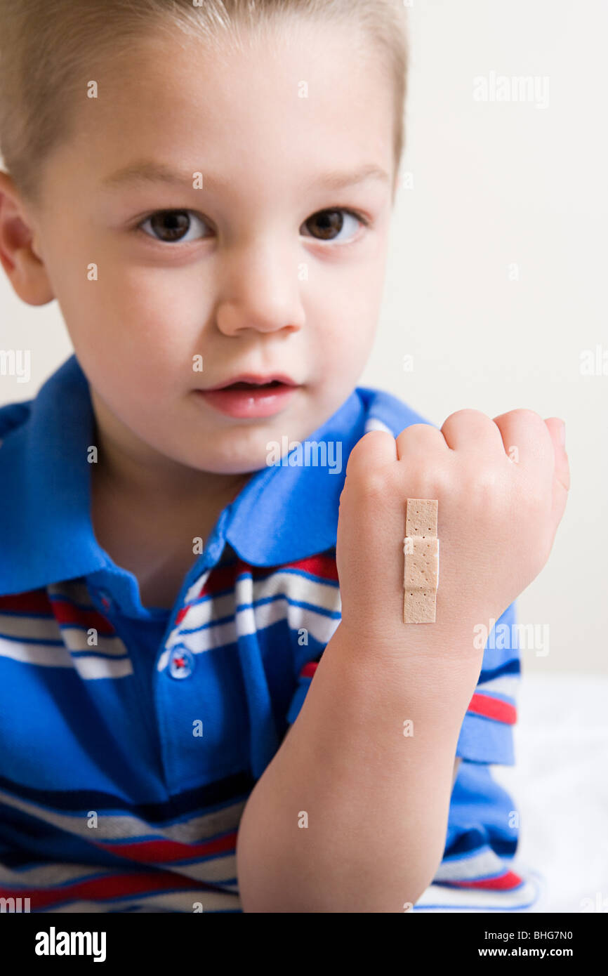 Boy with plaster on hand Stock Photo Alamy
