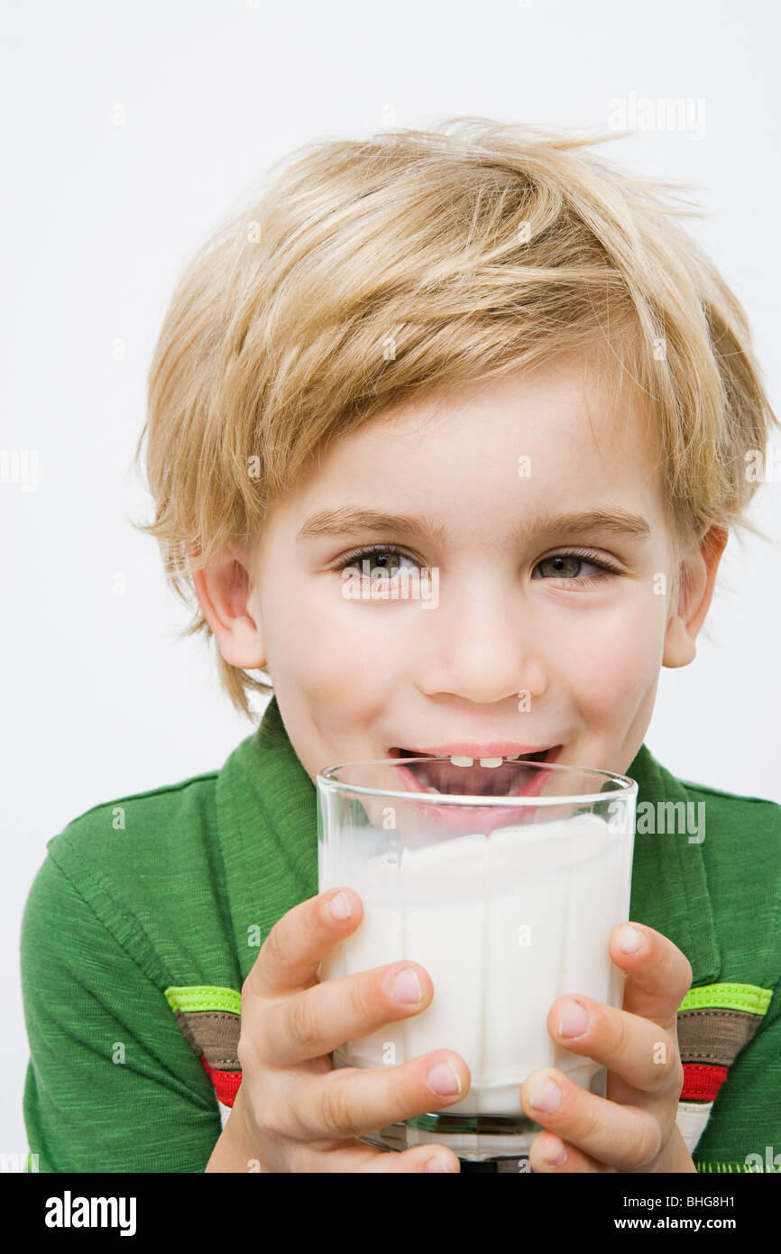 Boy with glass of milk Stock Photo - Alamy