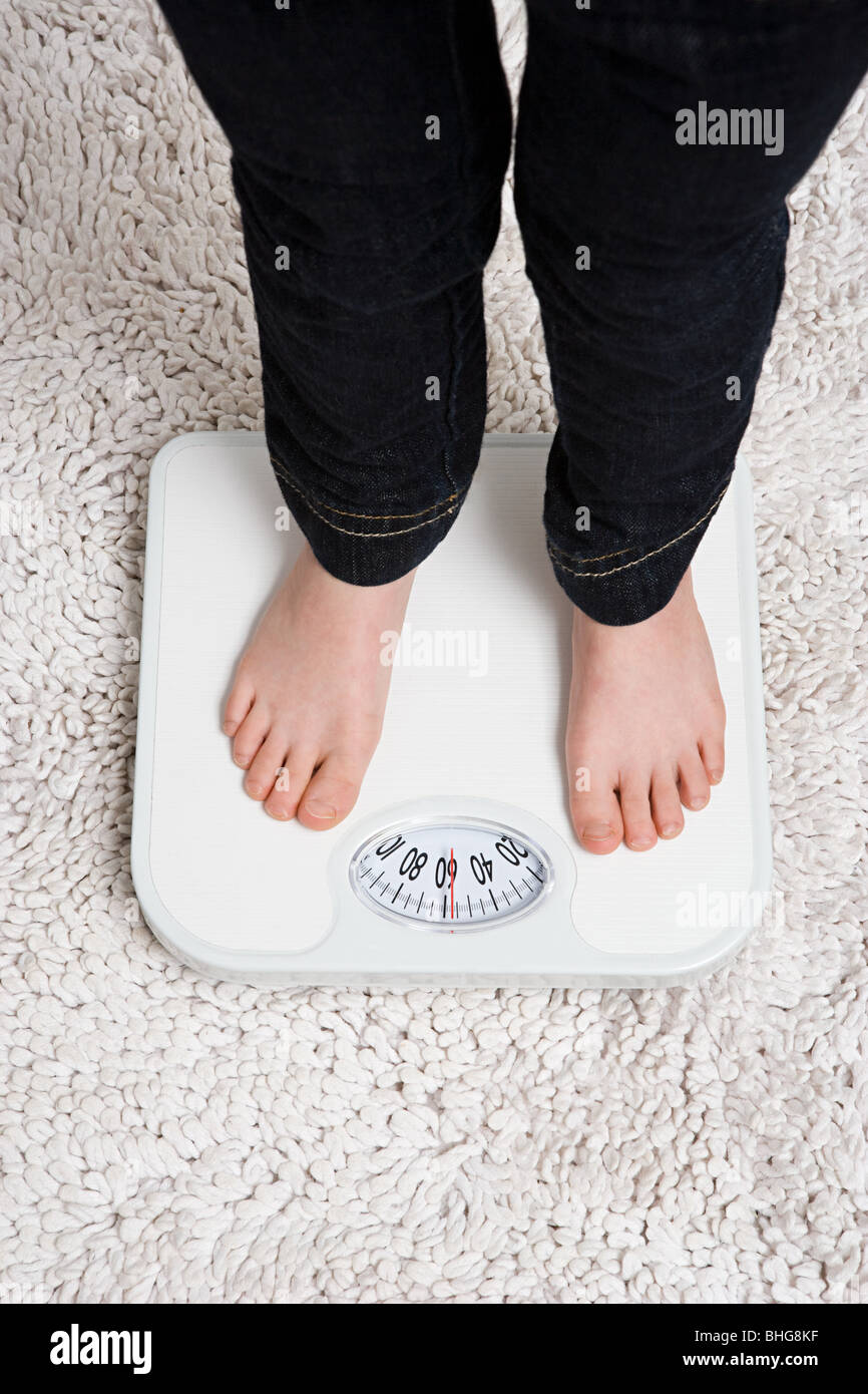 Child on weight scales Stock Photo