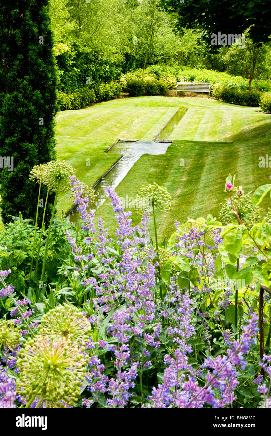A contemporary water feature or rill in a large English country garden Stock Photo