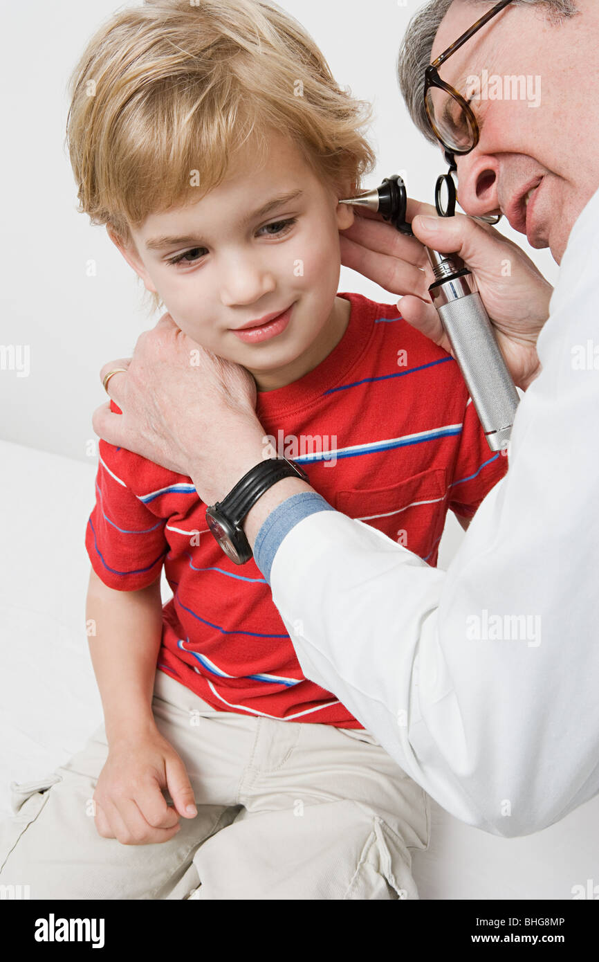 Doctor examining patient ear hi-res stock photography and images - Alamy