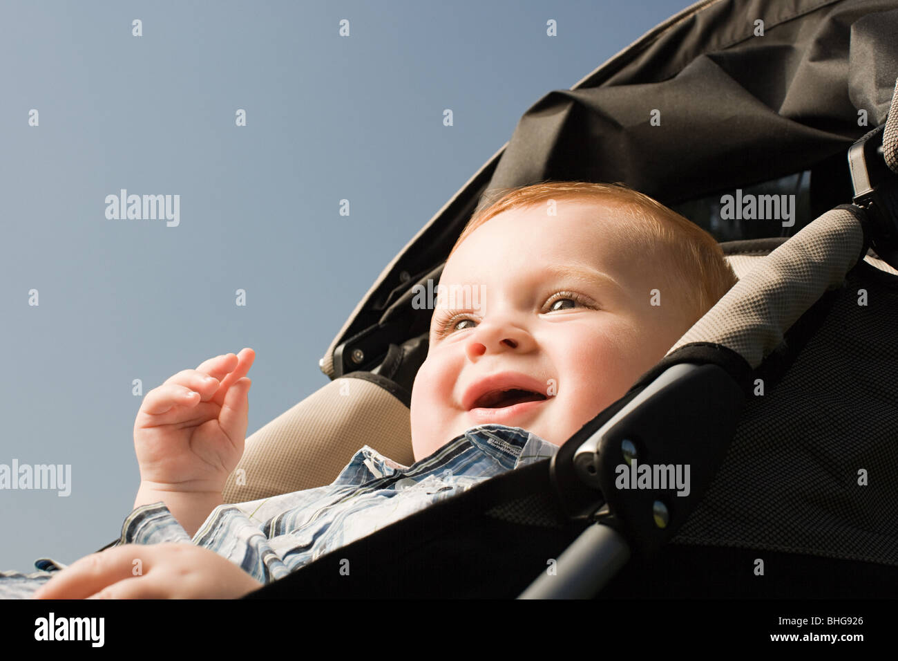 Baby in push chair Stock Photo