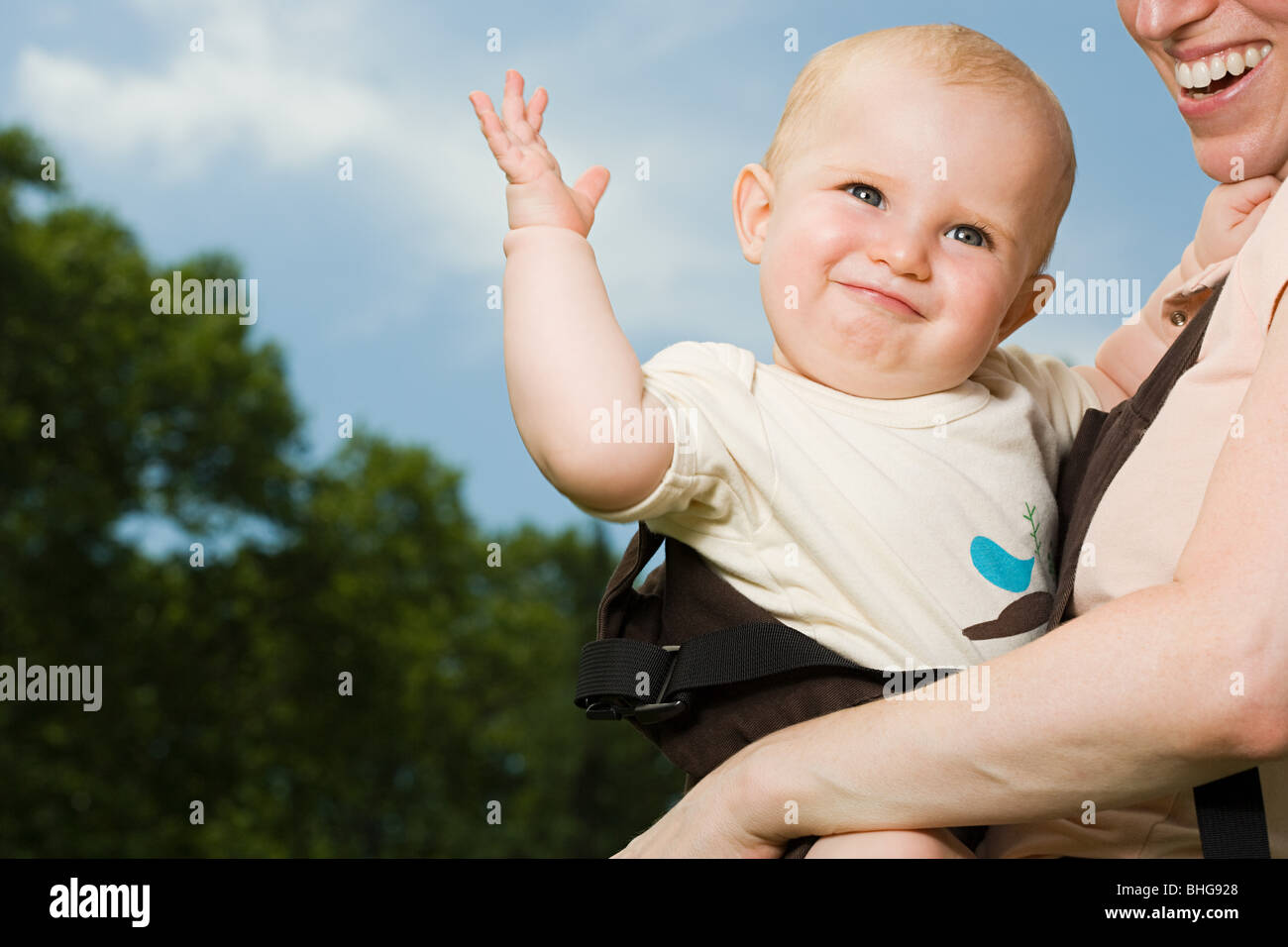 Mother carrying baby Stock Photo Alamy