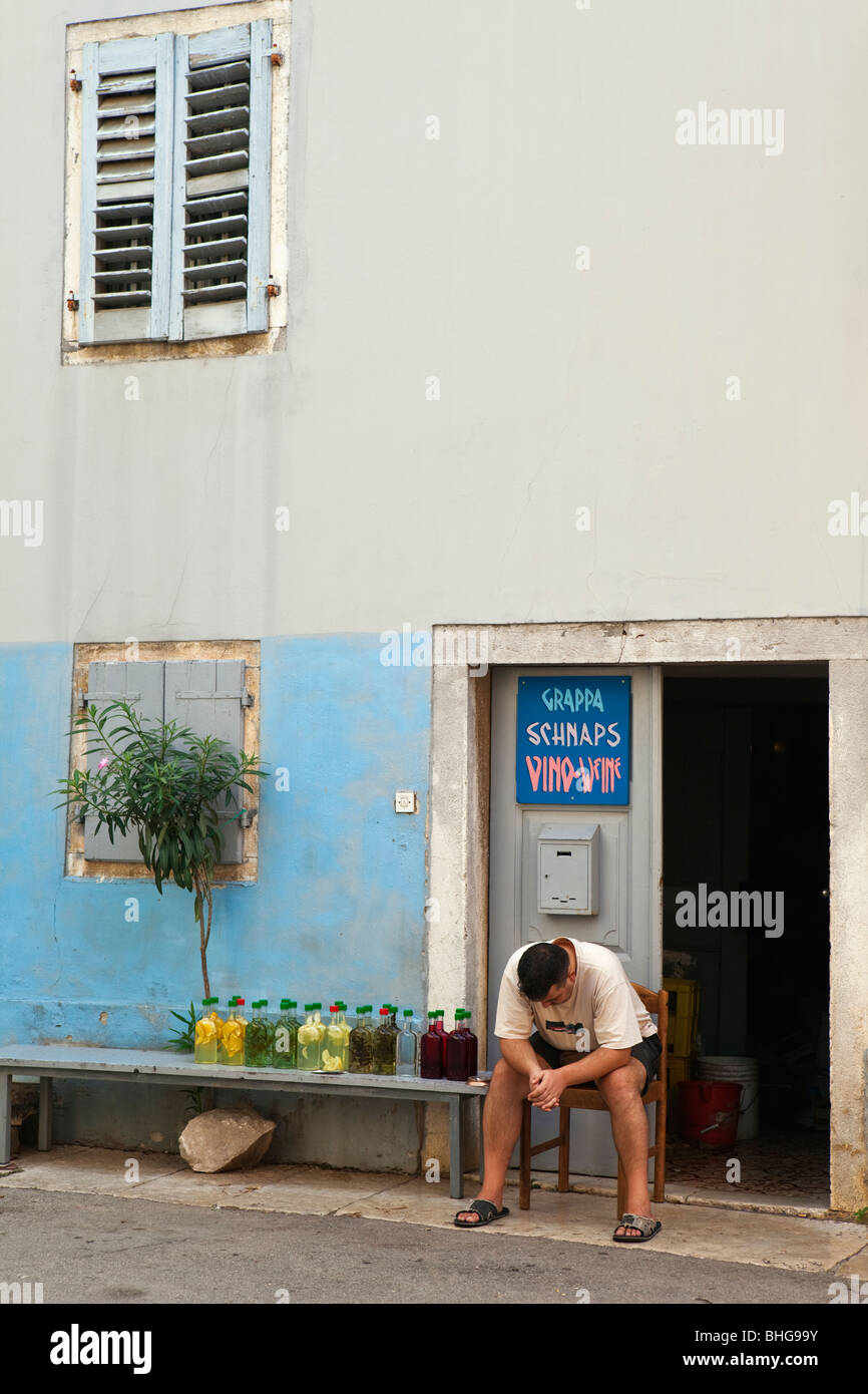 A man selling Grappa Vrsar Istria Croatia Stock Photo