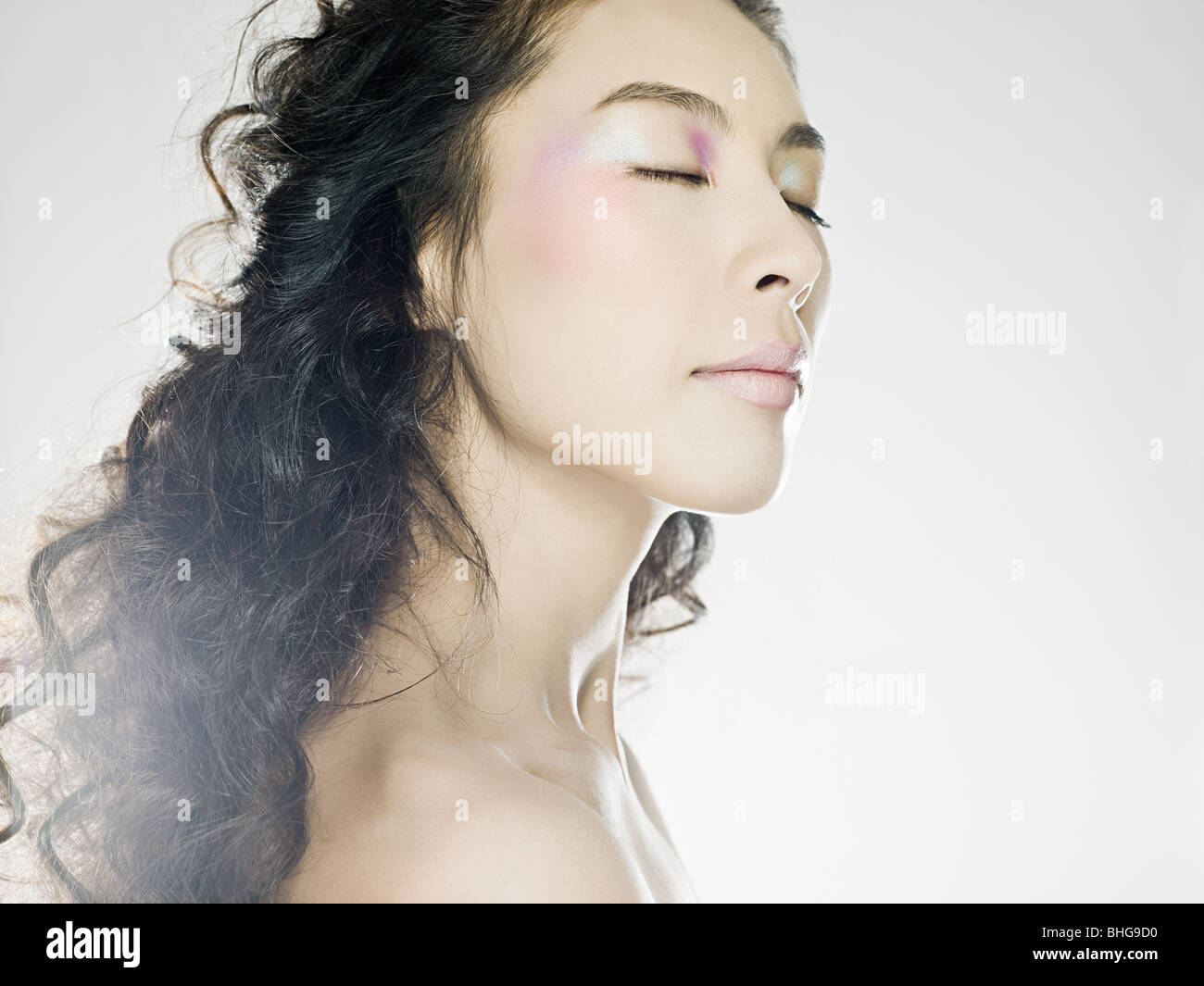 Young woman with eyes closed Stock Photo - Alamy