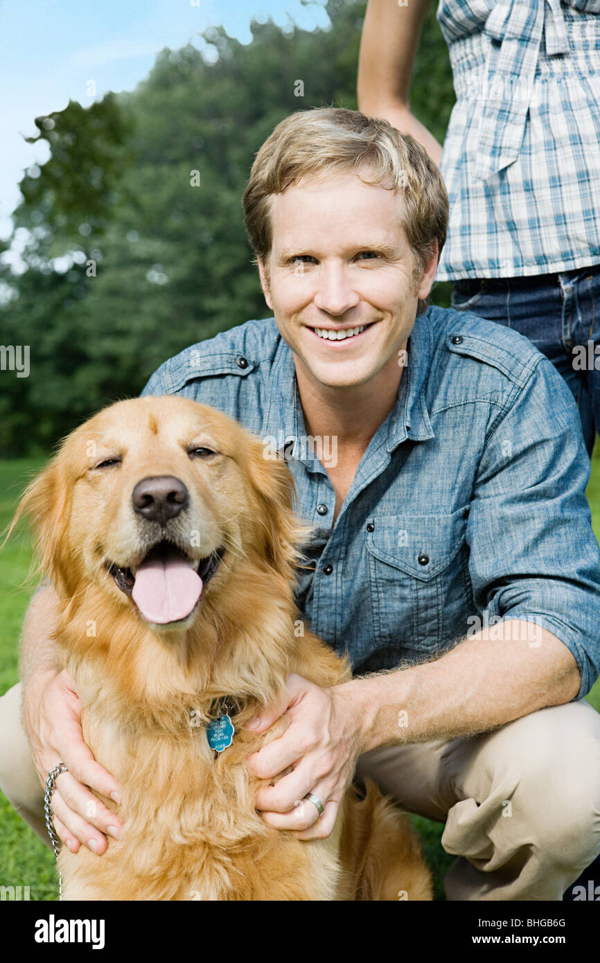 Man with golden retriever Stock Photo Alamy