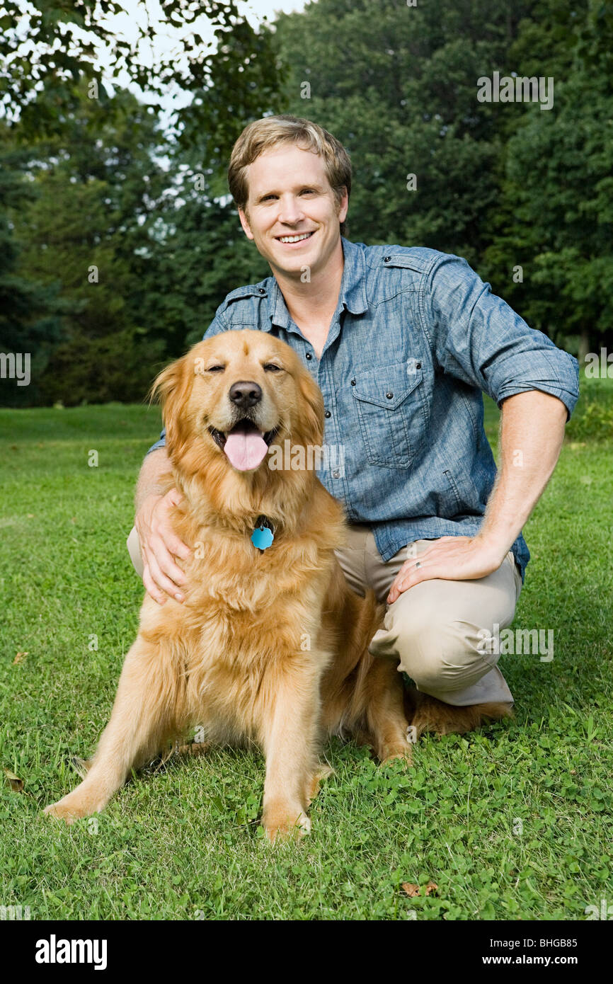 Man with golden retriever Stock Photo Alamy