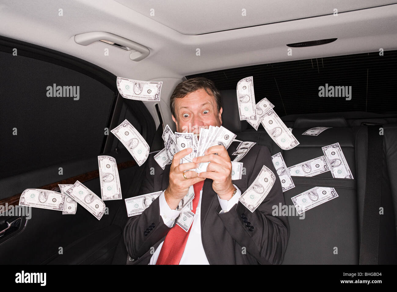 Wealthy businessman in the back of a car Stock Photo
