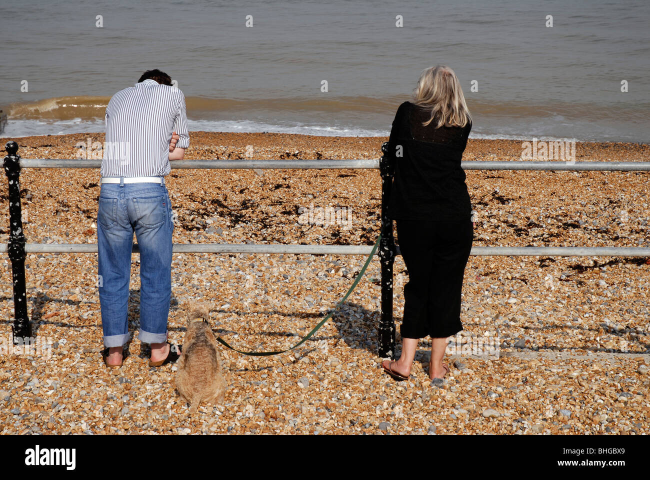 Couple having disagreement on walk by the seaside Stock Photo