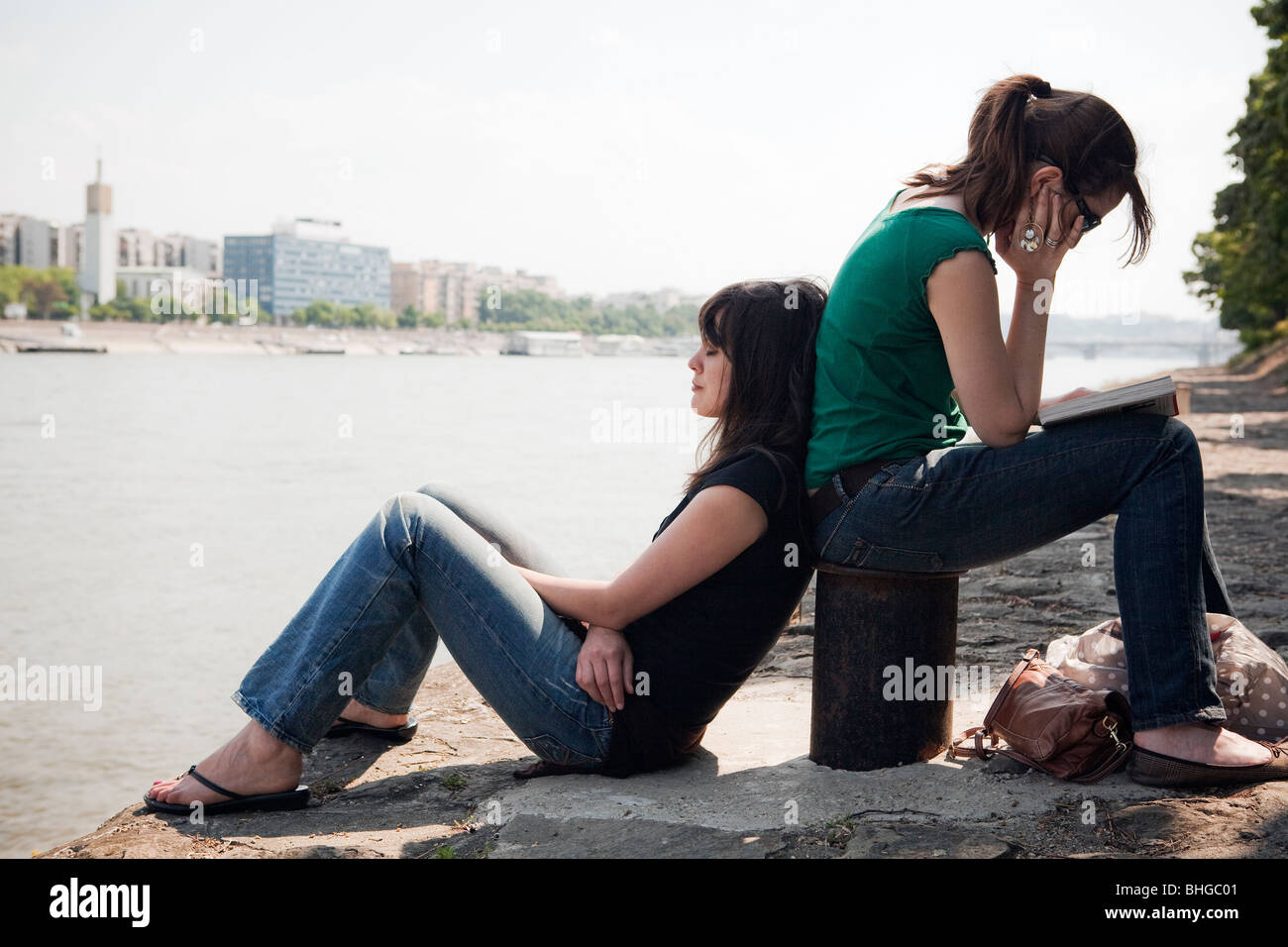 Two women in park sitting hi-res stock photography and images - Alamy