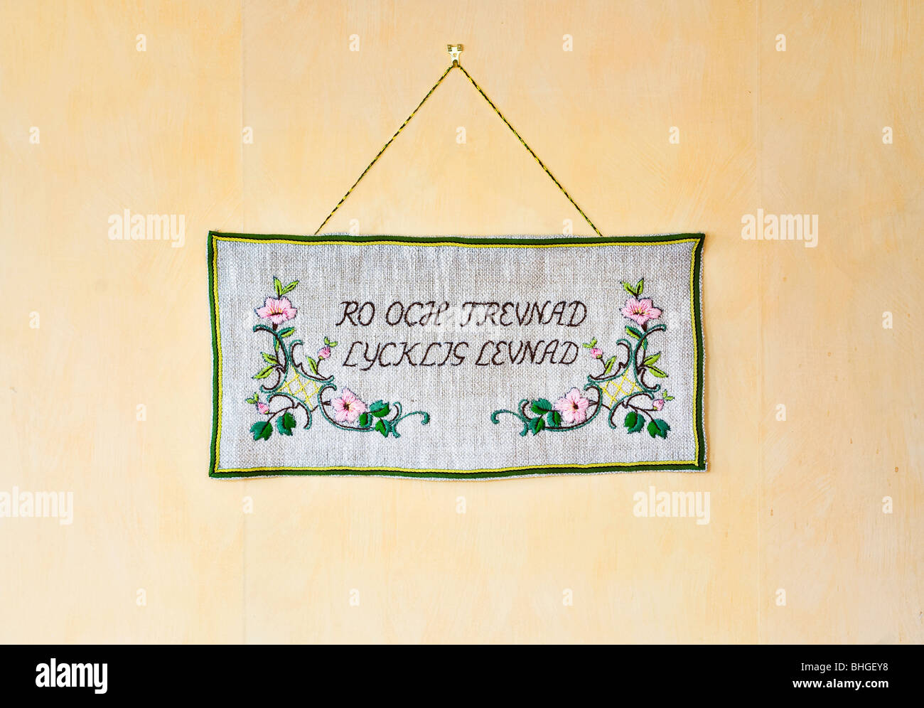Embroidered message on a wall hanging, Sweden Stock Photo - Alamy