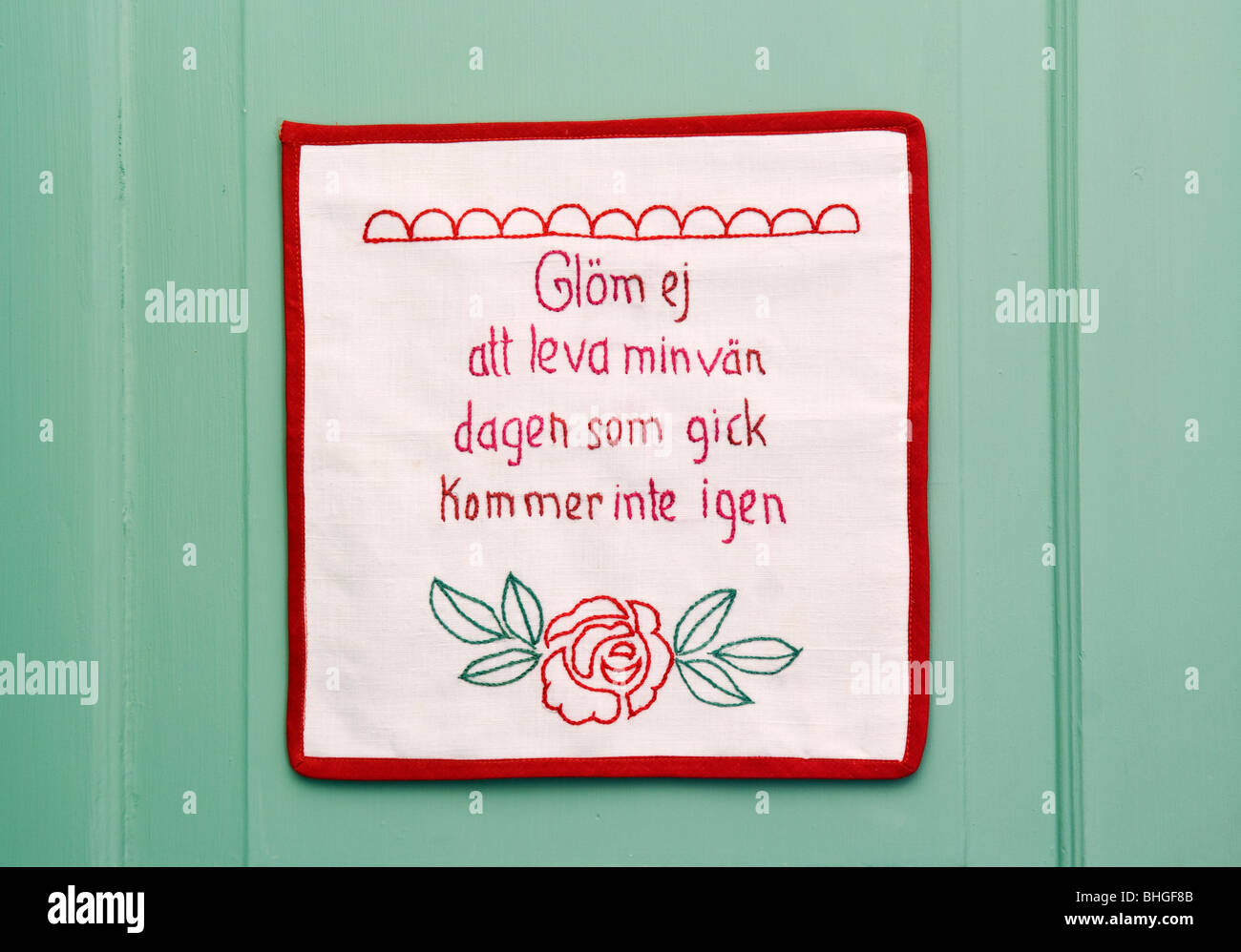 Embroidered message on a wall hanging, Sweden Stock Photo - Alamy