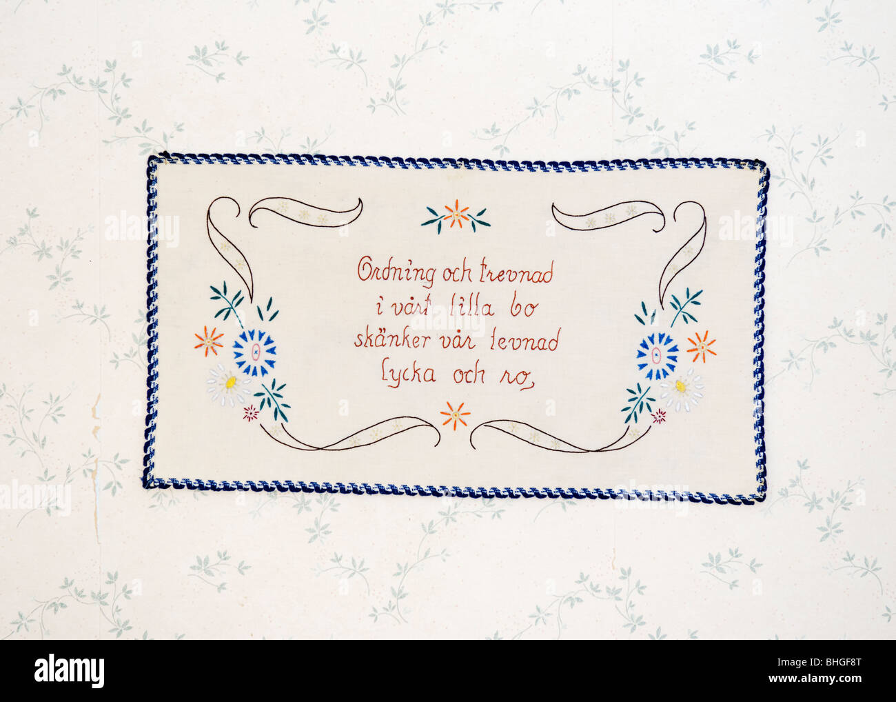 Embroidered message on a wall hanging, Sweden Stock Photo - Alamy