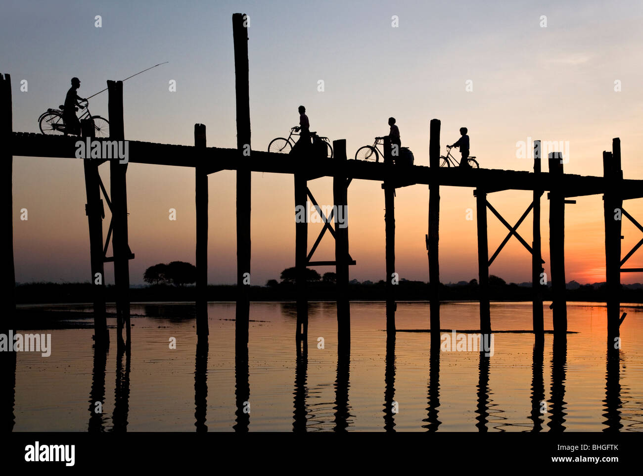 Burmese people crossing U Bein´s bridge. Amarapura. Myanmar Stock Photo ...