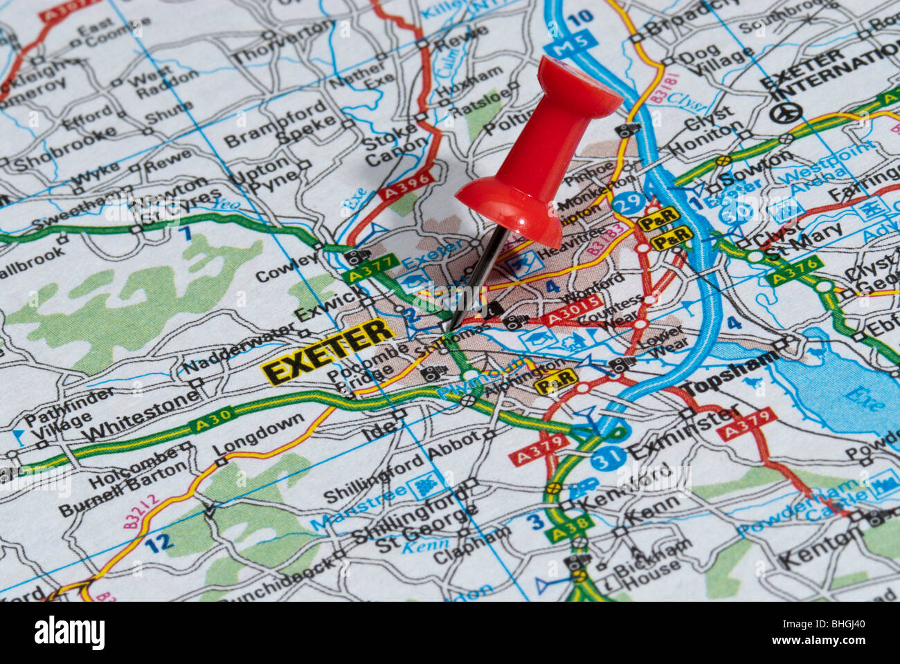 red map pin in road map pointing to city of Exeter Stock Photo