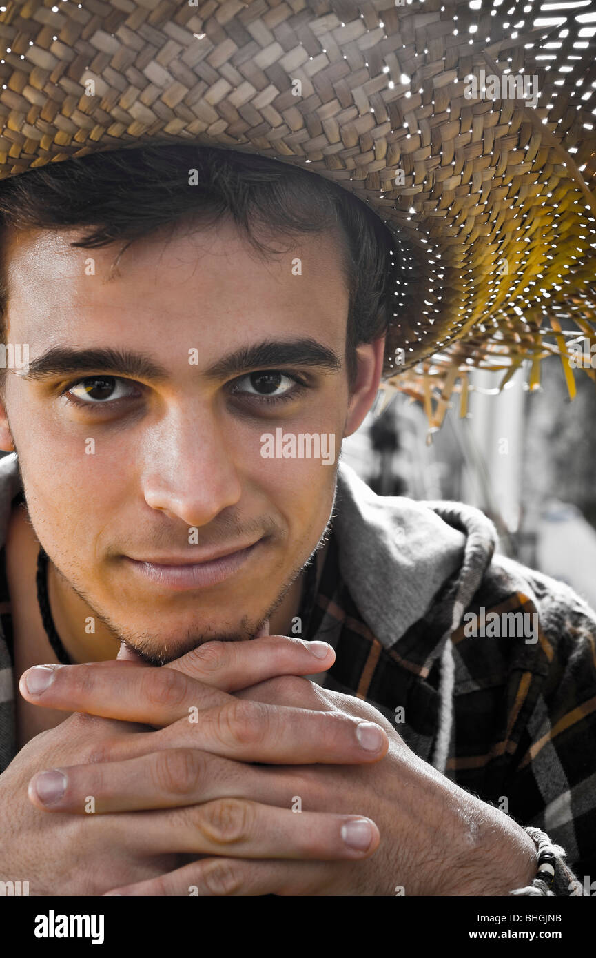 Young man Portrait under heavy sun Stock Photo