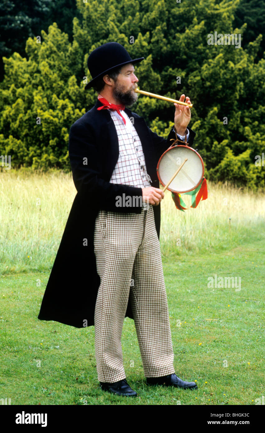 Victorian historical re-enactment, itinerant musician entertainer musical music entertainment entertainer man playing musical Stock Photo