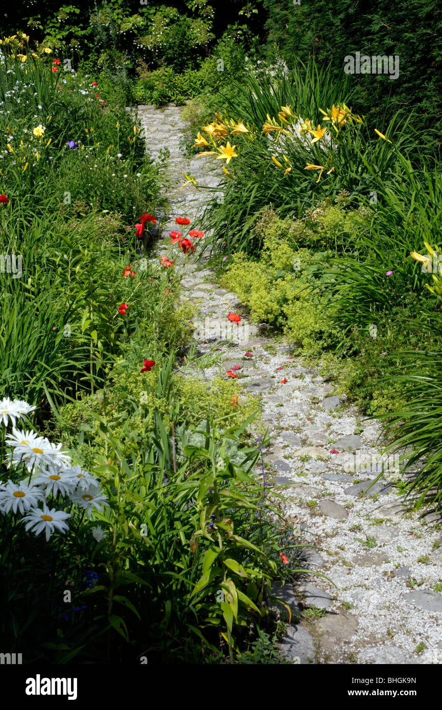 Garden path flowers Maine coast USA New England Stock Photo