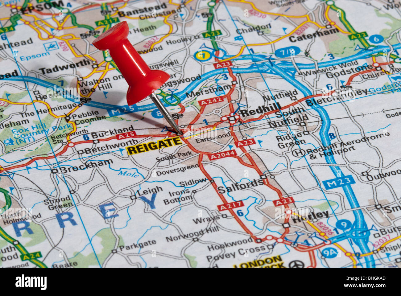 red map pin in road map pointing to city of Reigate Stock Photo