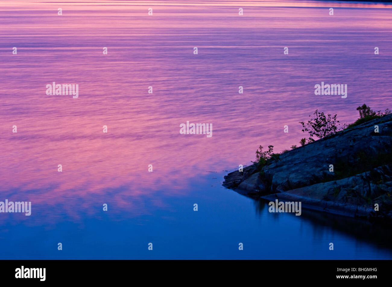 Dawn skies reflected in Simon Lake, Greater Sudbury, Ontario, Canada Stock Photo