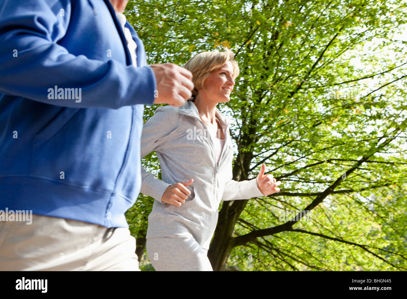 Middle aged couple jogging Stock Photo