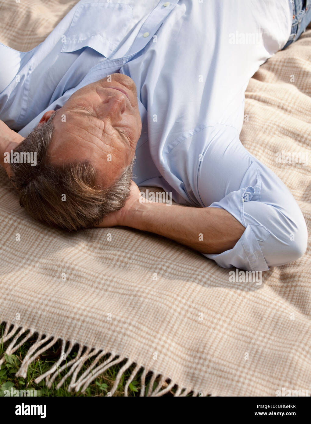 Man lying relaxed on a blanket Stock Photo Alamy